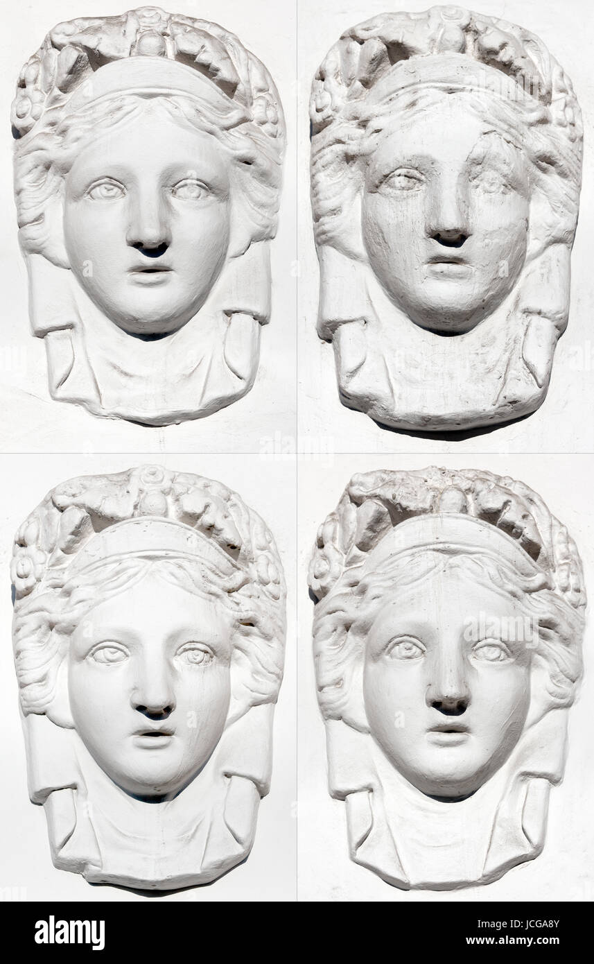 A set of stucco women`s portraits from the facade of the Lensovet Theater in St. Petersburg Stock Photo